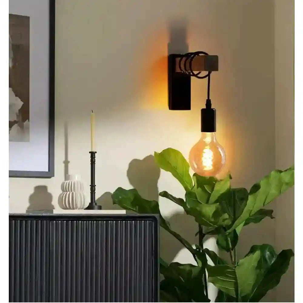 Black industrial wooden wall sconce with exposed vintage-style LED bulb and metal fixture.