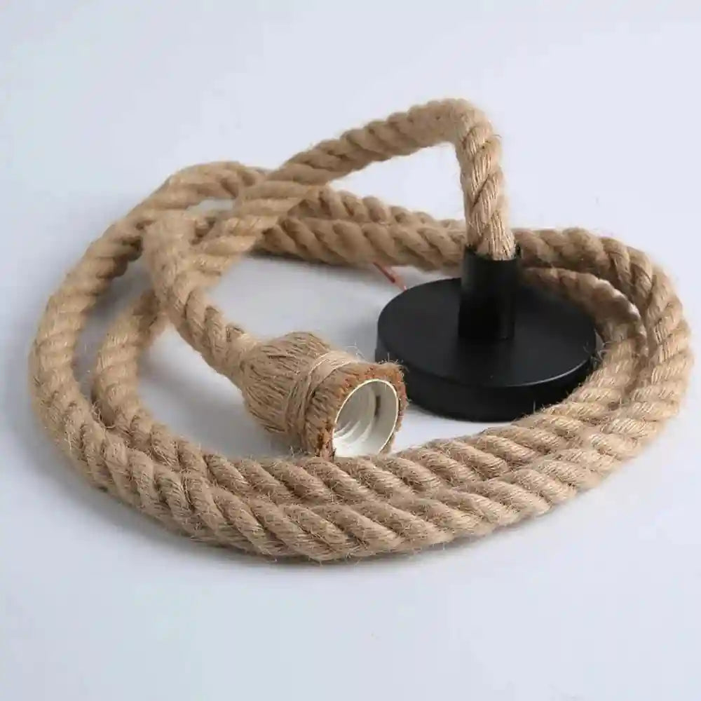 Natural jute rope pendant light cord with black metal ceiling mount and bulb socket.