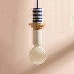 Nordic wood pendant light with stacked blue and natural wood elements and large round bulb.