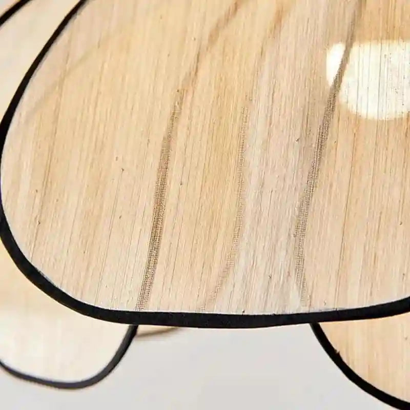 Elegant flower-shaped ceiling light with translucent petals and black metal frame.