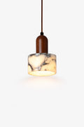 Modern pendant light with marble-effect cylindrical shade and wooden top, warm LED glow.
