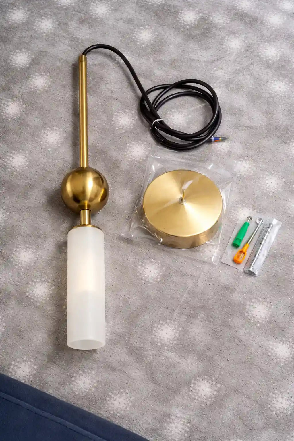 Gold and black LED pendant light with frosted cylindrical glass shade and round ceiling mount.