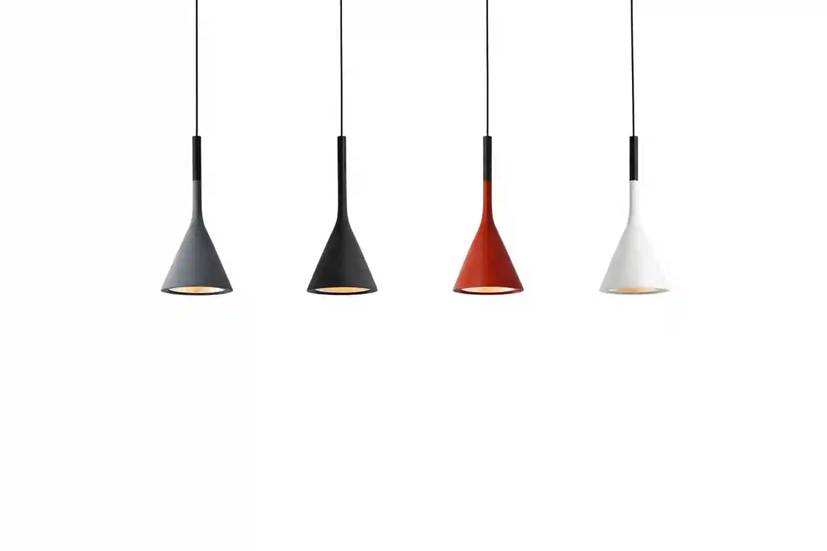 Four cone-shaped pendant lights in black, black, red, and white with slim black cords against a white background.